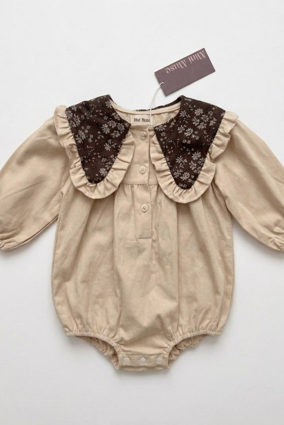 Romper with a floral print and collar