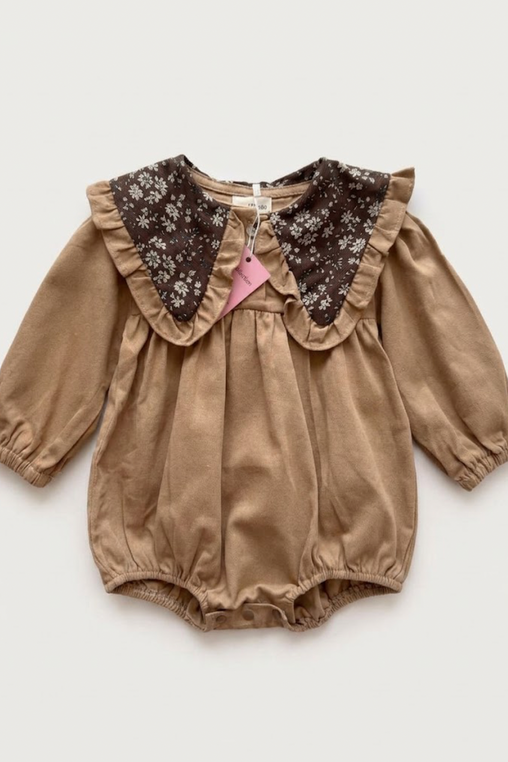 Brown baby romper with a floral print and collar
