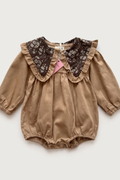 Brown baby romper with a floral print and collar